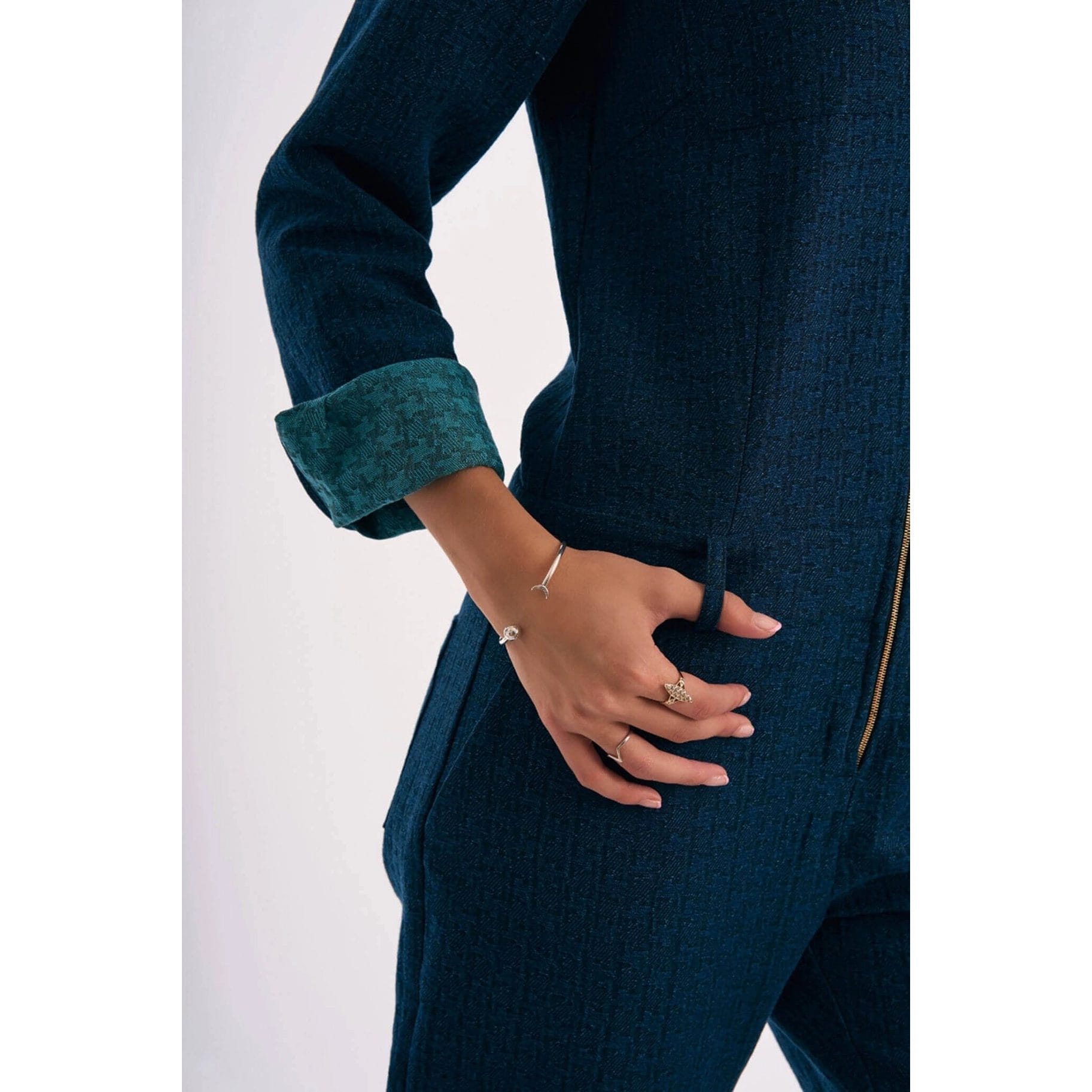 Denim jumpsuit with a golden zip closure