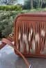 - Front of the bag is made with small leather straps turned over